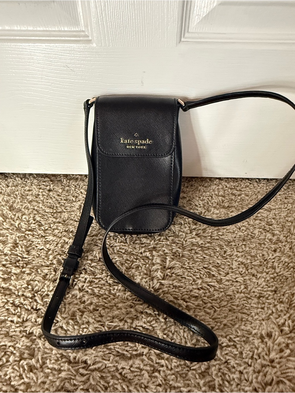 kate spade black leather crossbody phone pouch with gold logo